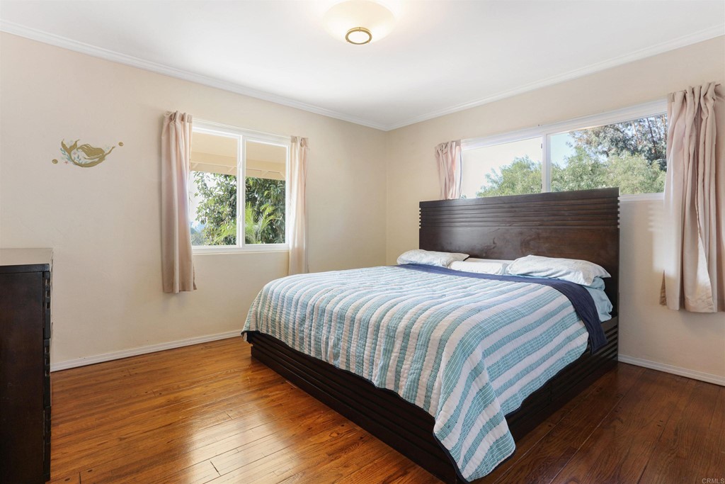 1188 Crystal Lane El Cajon, CA 92020 - Photo 17 of 26 a bedroom with a bed and window