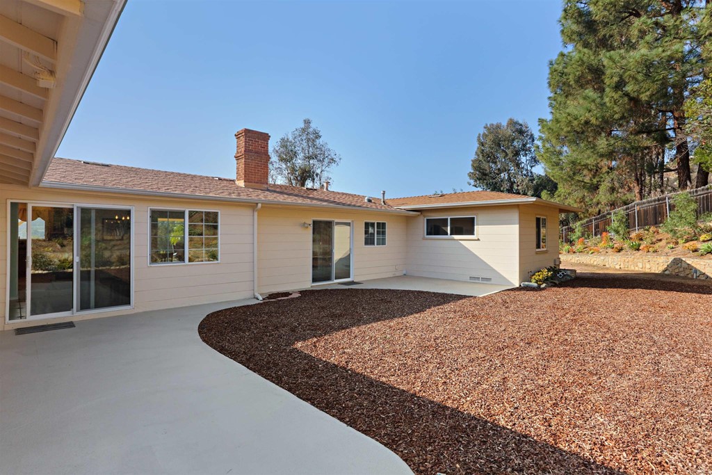 1188 Crystal Lane El Cajon, CA 92020 - Photo 21 of 26 a front view of a house with a garden