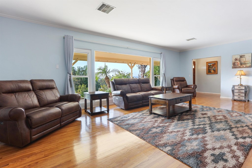 1188 Crystal Lane El Cajon, CA 92020 - Photo 7 of 26 a living room with furniture and a large window