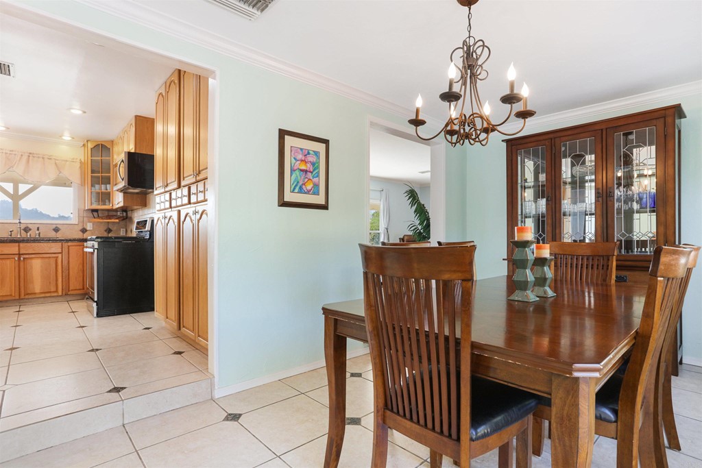 1188 Crystal Lane El Cajon, CA 92020 - Photo 10 of 26 a view of a dining room with furniture window and wooden floor