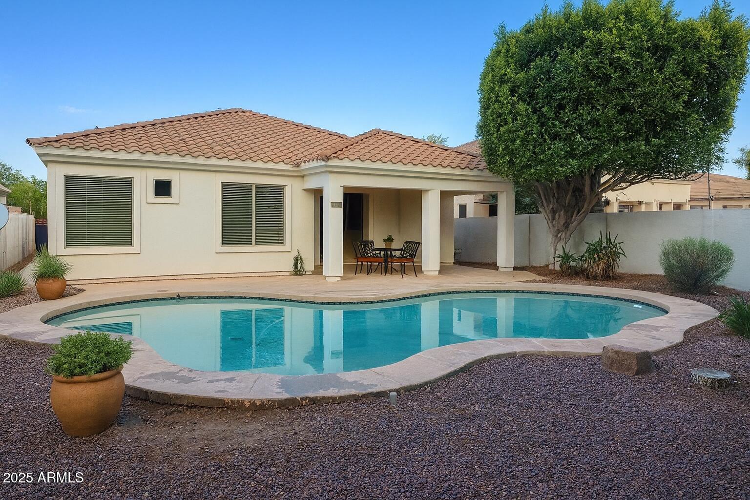 231 East Krista Way Tempe, AZ 85284 - Photo 15 of 20 a view of a house with a small yard and a large tree