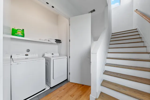 a view of storage and utility room with washer and dryer