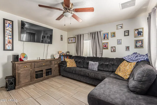 a living room with furniture and flat screen tv