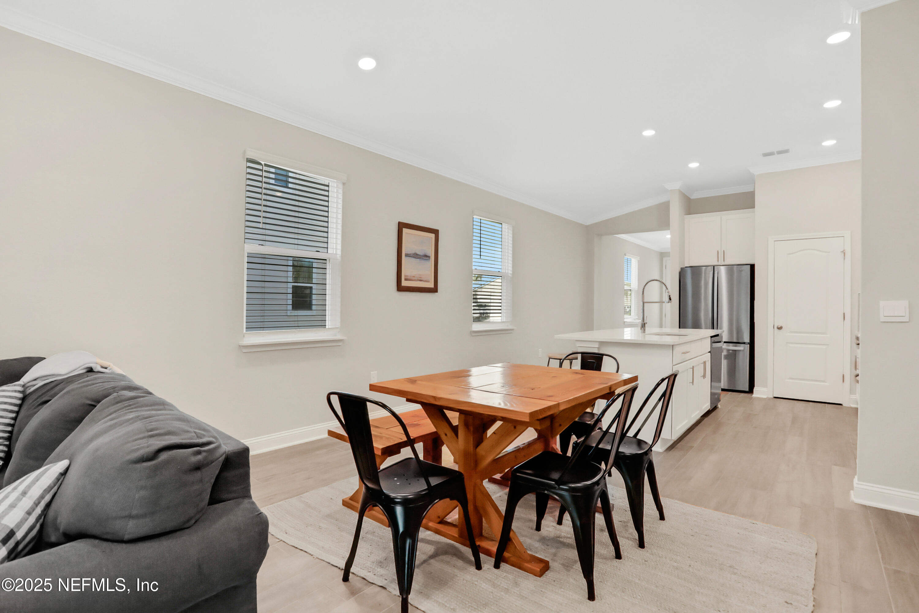 404 Thistleton Way St. Augustine, FL 32092 - Photo 11 of 35 a view of a dining room with furniture and a dining table