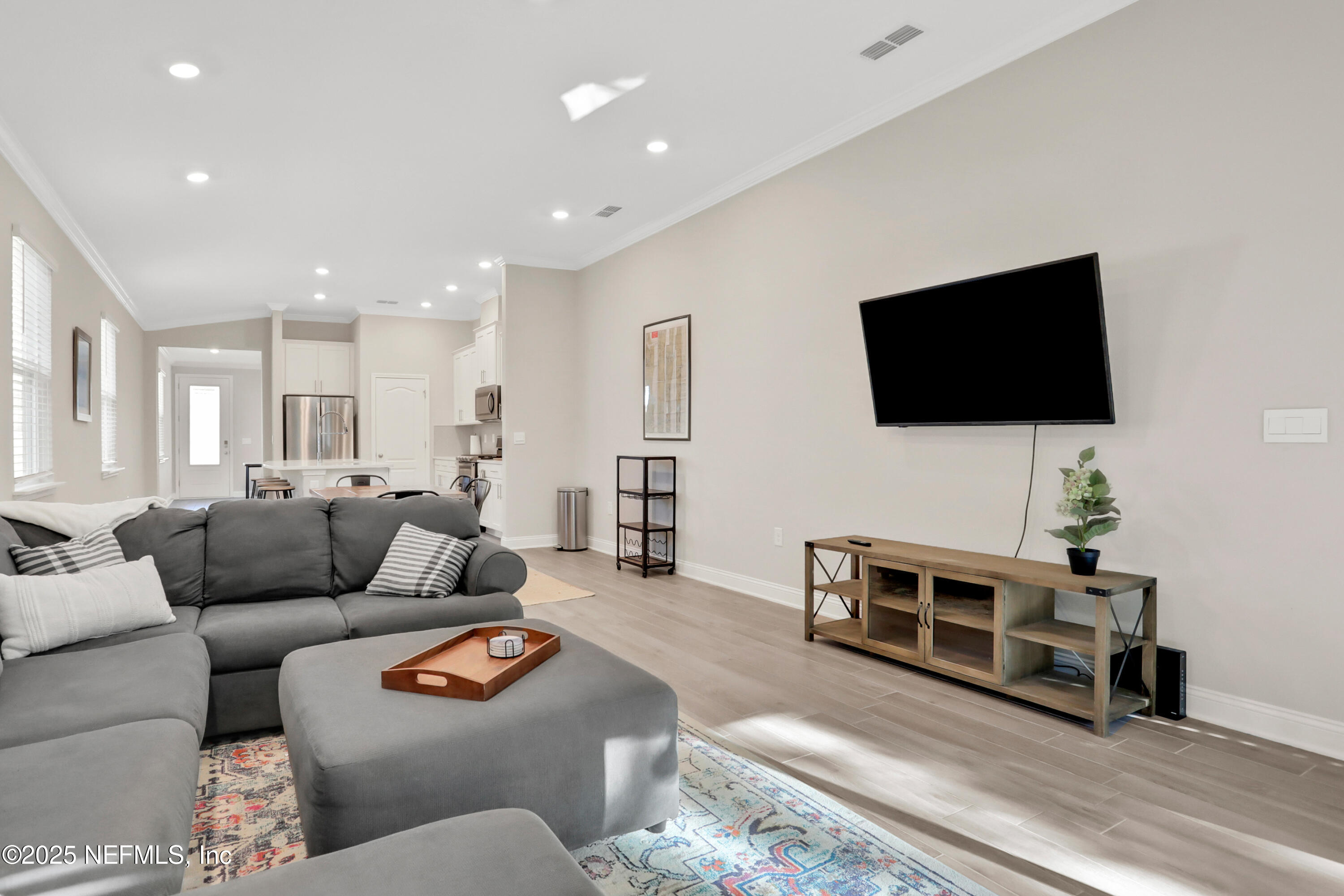 404 Thistleton Way St. Augustine, FL 32092 - Photo 14 of 35 a living room with furniture and a flat screen tv