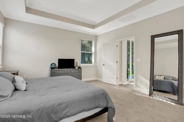 a bedroom with a bed and a couch