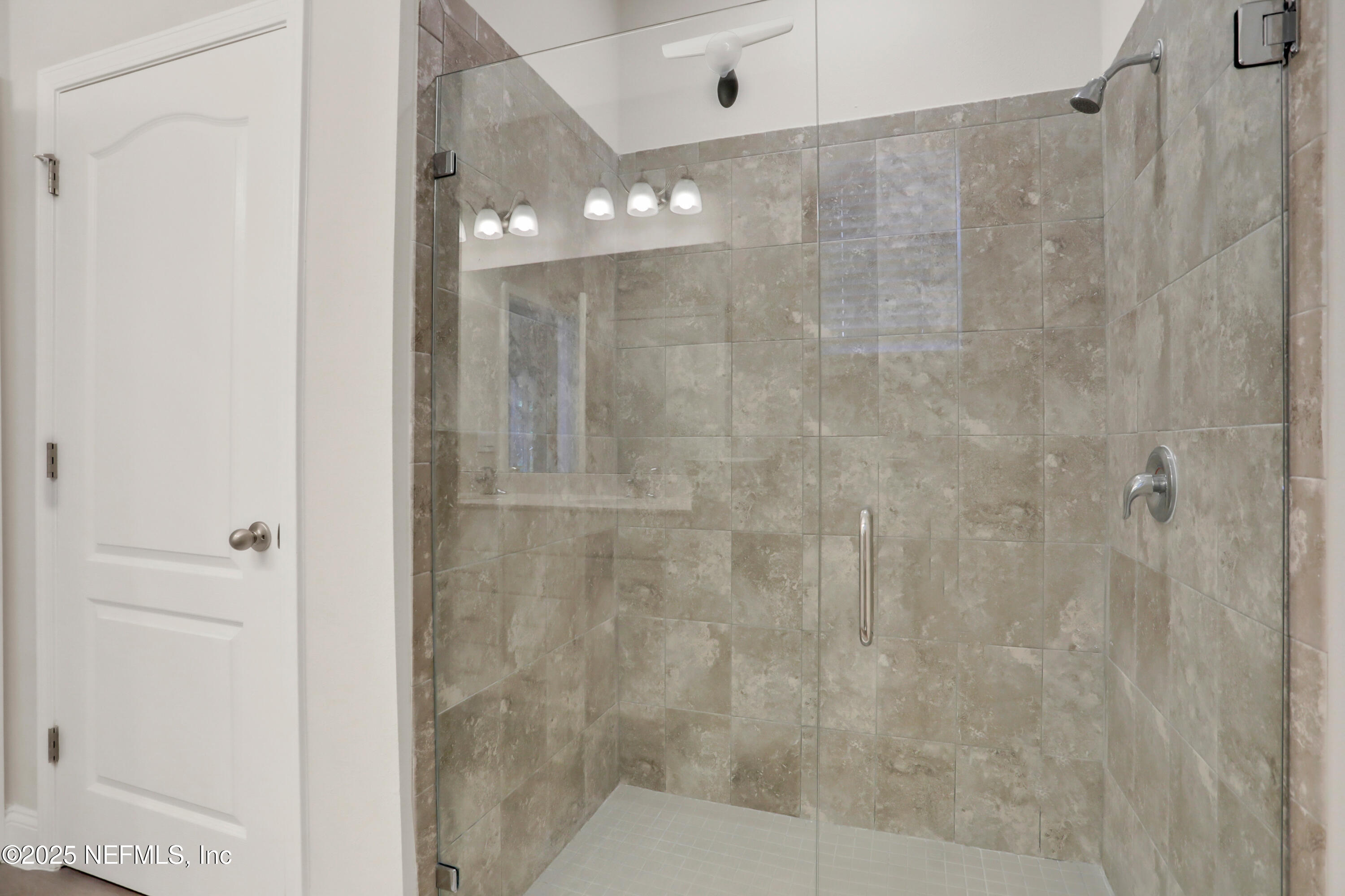 404 Thistleton Way St. Augustine, FL 32092 - Photo 19 of 35 a bathroom with a shower