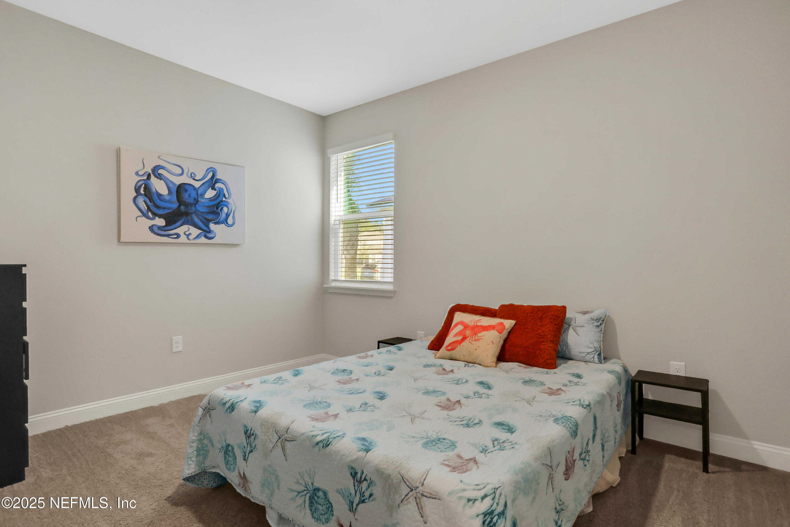 404 Thistleton Way St. Augustine, FL 32092 - Photo 24 of 35 a bedroom with a bed and a lamp on dresser
