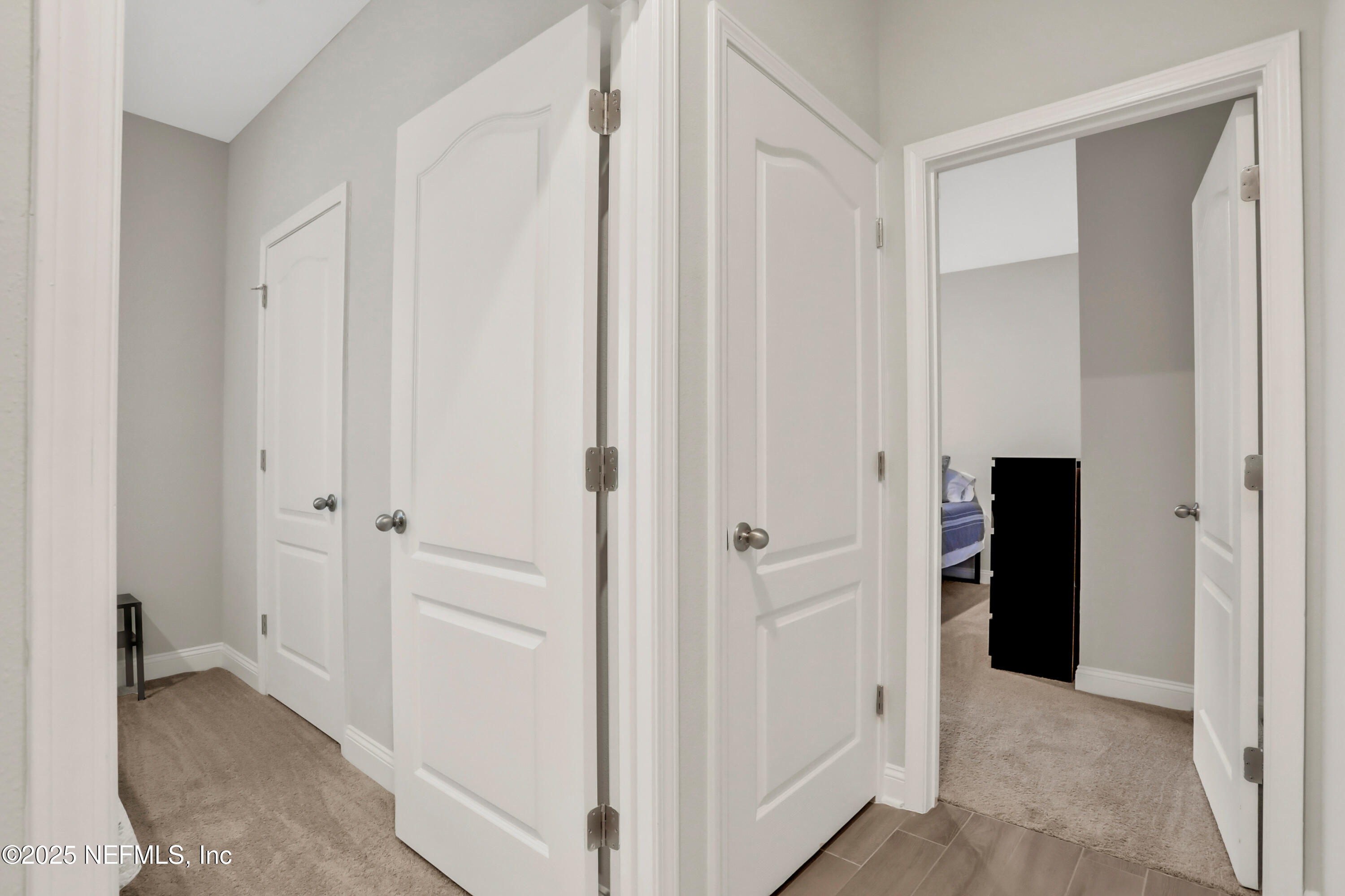404 Thistleton Way St. Augustine, FL 32092 - Photo 29 of 35 a view of a hallway with an empty room