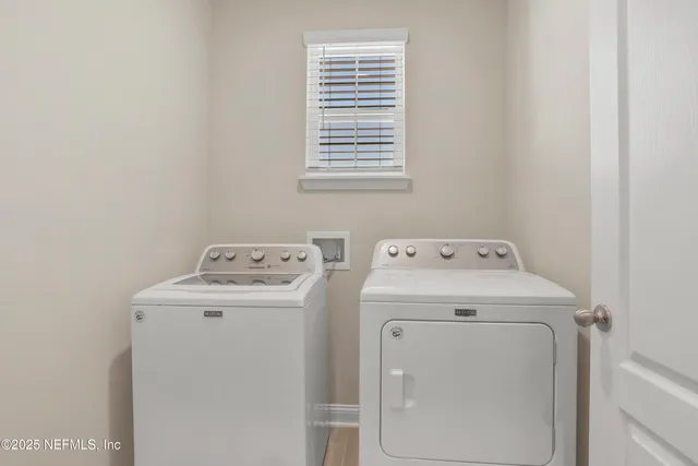 a utility room with dryer and washer