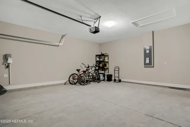 a view of a garage with rack and bicycle