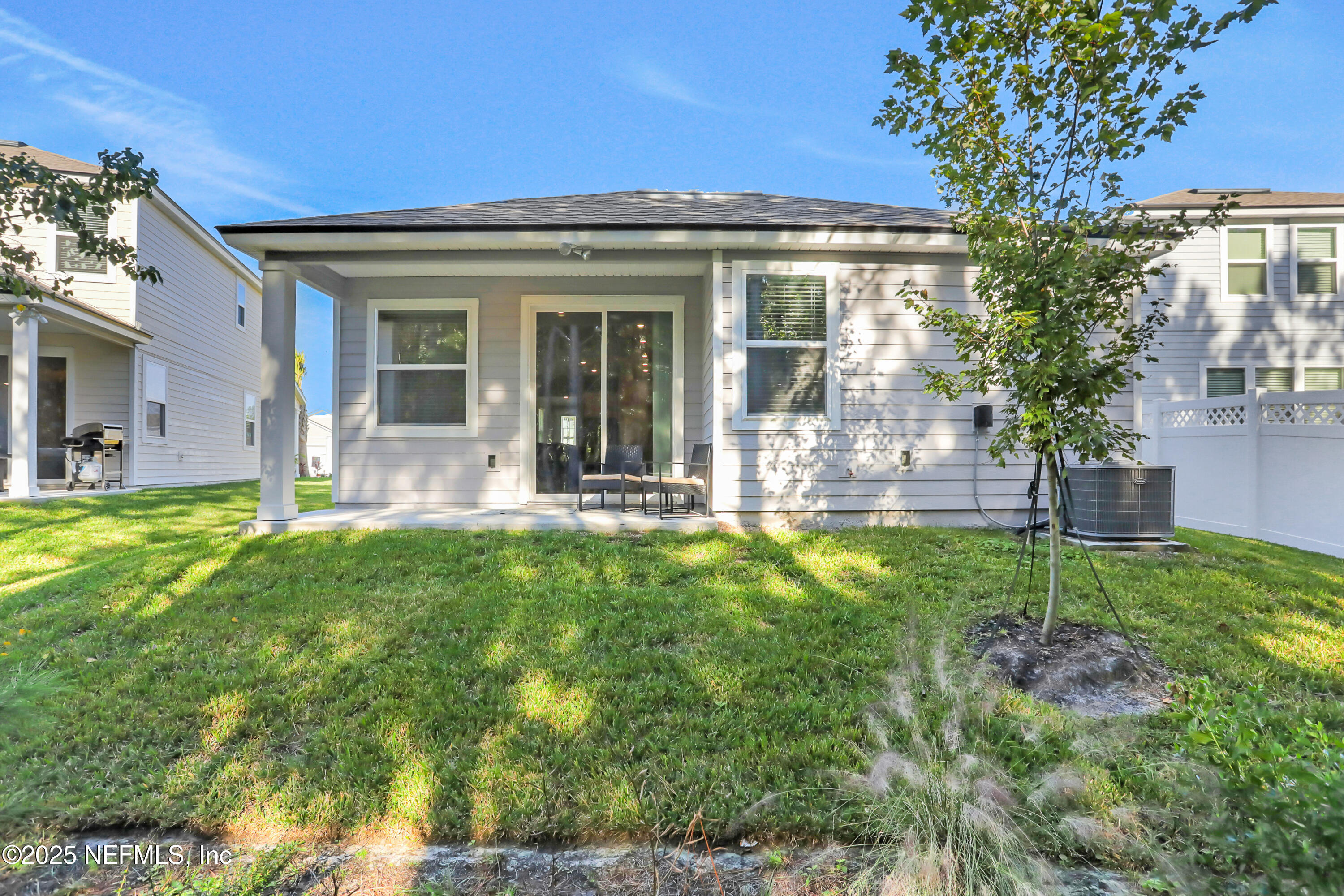 404 Thistleton Way St. Augustine, FL 32092 - Photo 34 of 35 a front view of a house with a yard