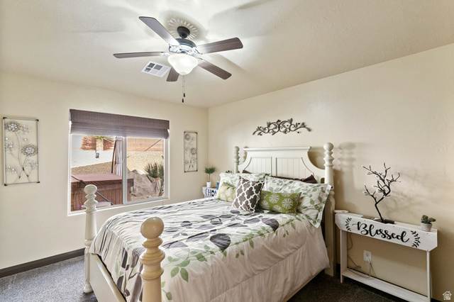 210 Talon Court Ivins, UT 84738 - Photo 40 of 60 Bedroom with dark colored carpet and a ceiling fan