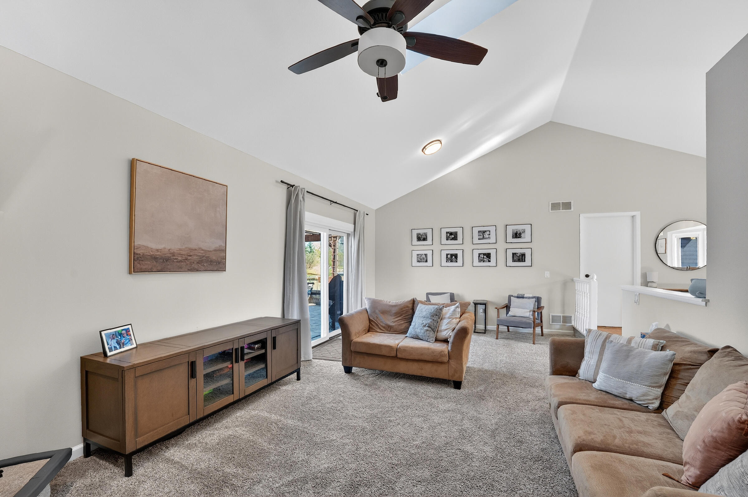 W199N17111 Ridgeway Drive Jackson, WI 53037 - Photo 6 of 29 Vaulted ceilings & access to patio