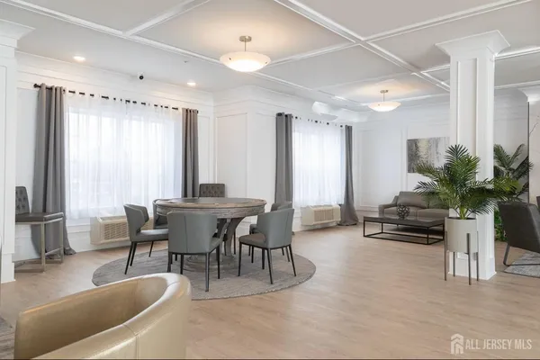 a dining room with furniture and window