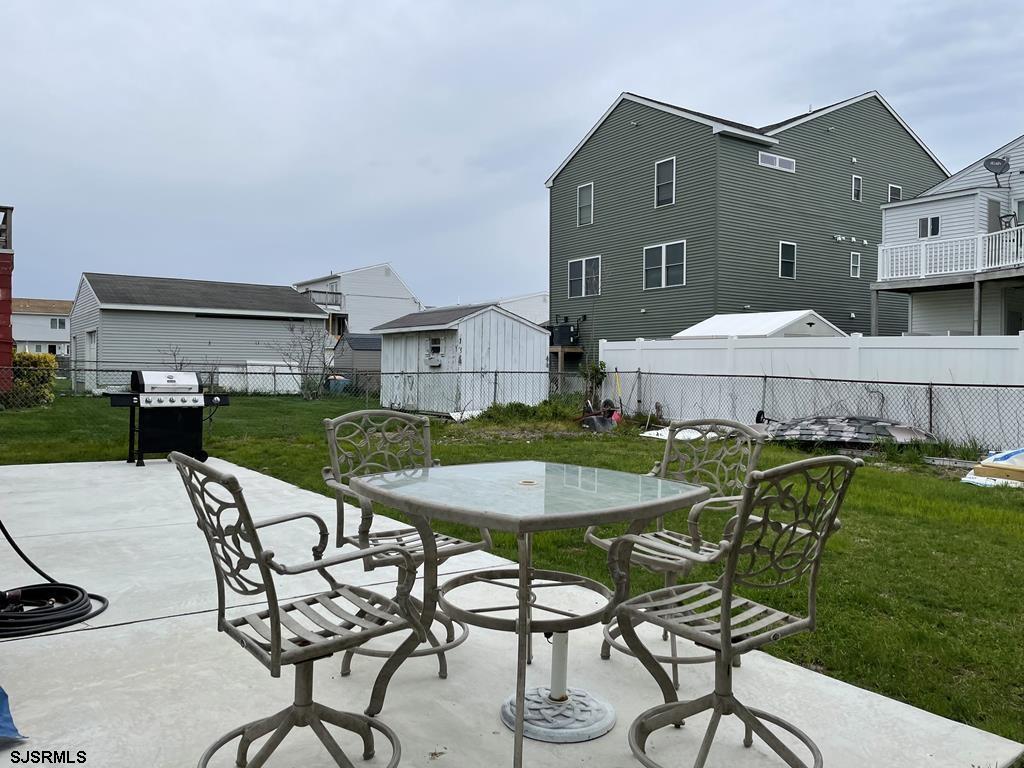 111 10th Street South, Unit B Brigantine, NJ 08203 - Photo 14 of 19 a aerial view of a house with table and chairs