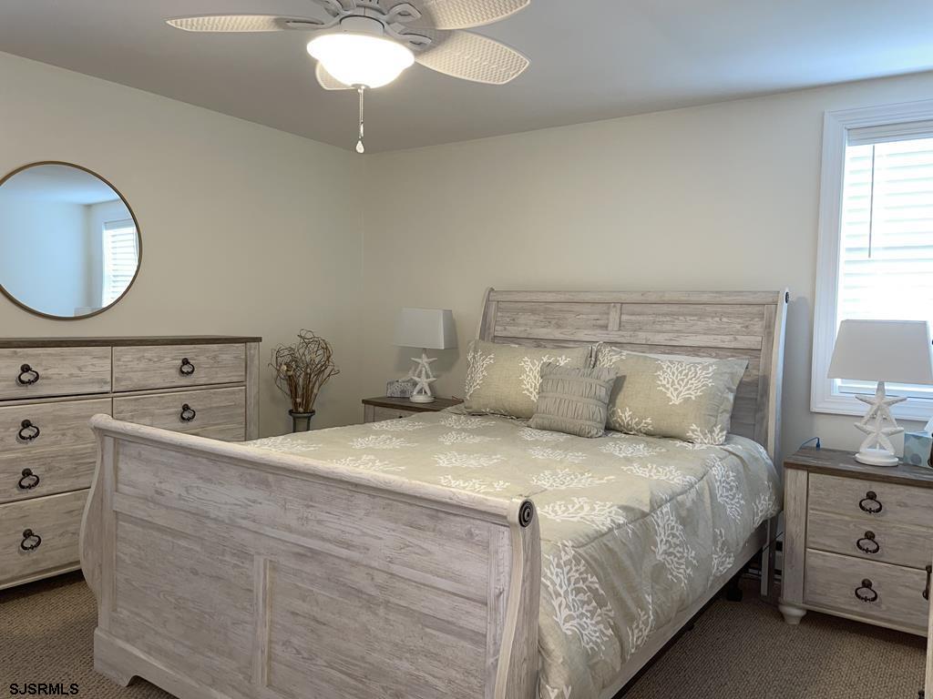 111 10th Street South, Unit B Brigantine, NJ 08203 - Photo 3 of 19 a bedroom with a bed and a dresser