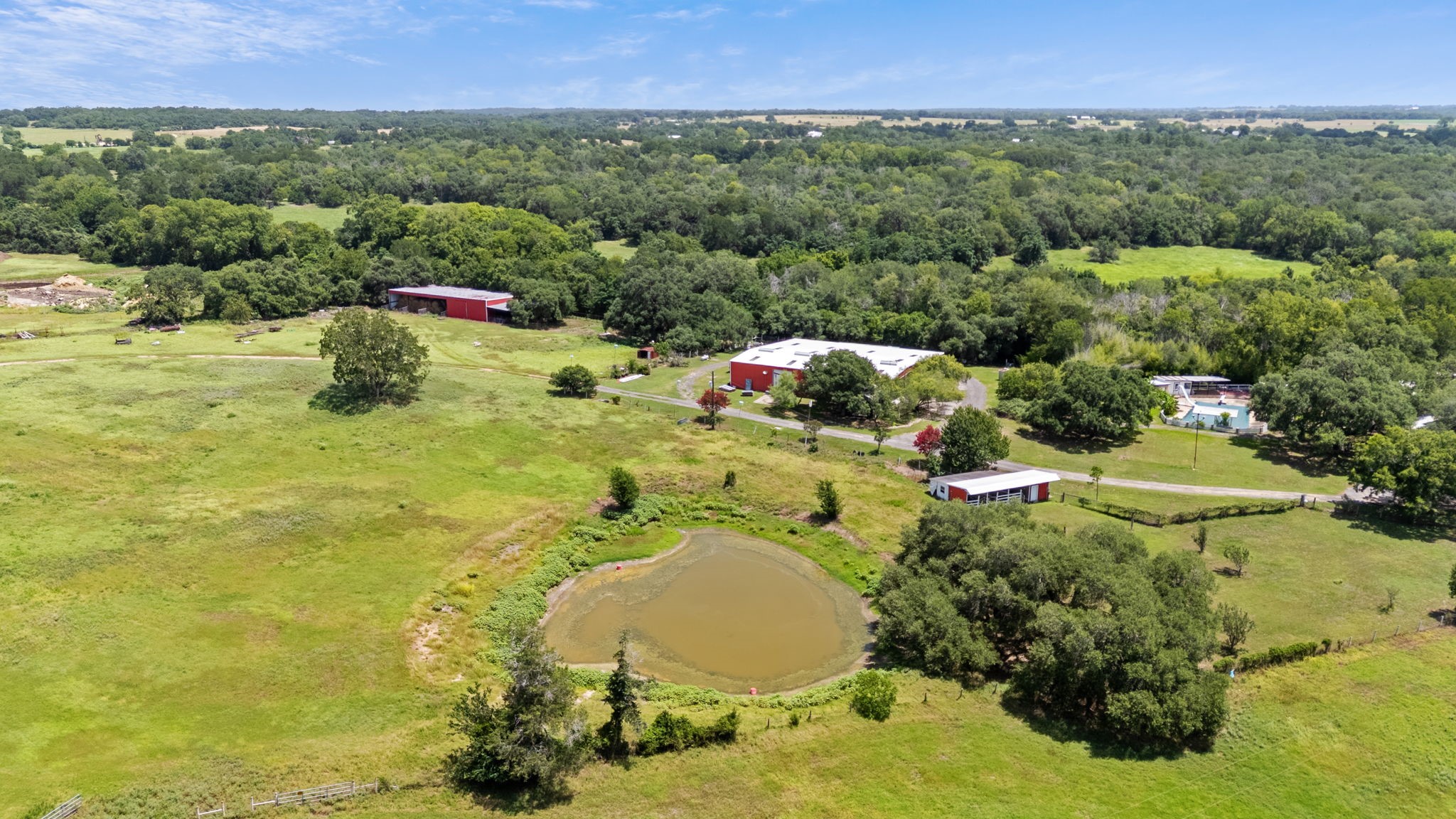 3541 Highway 159 La Grange, TX 78945 - Photo 4 of 38 Ideally located just 5 minutes from H-E-B and Downtown La Grange, and 20 minutes from Round Top, this property is perfect for a weekend retreat, family ranch, or full-time homestead.