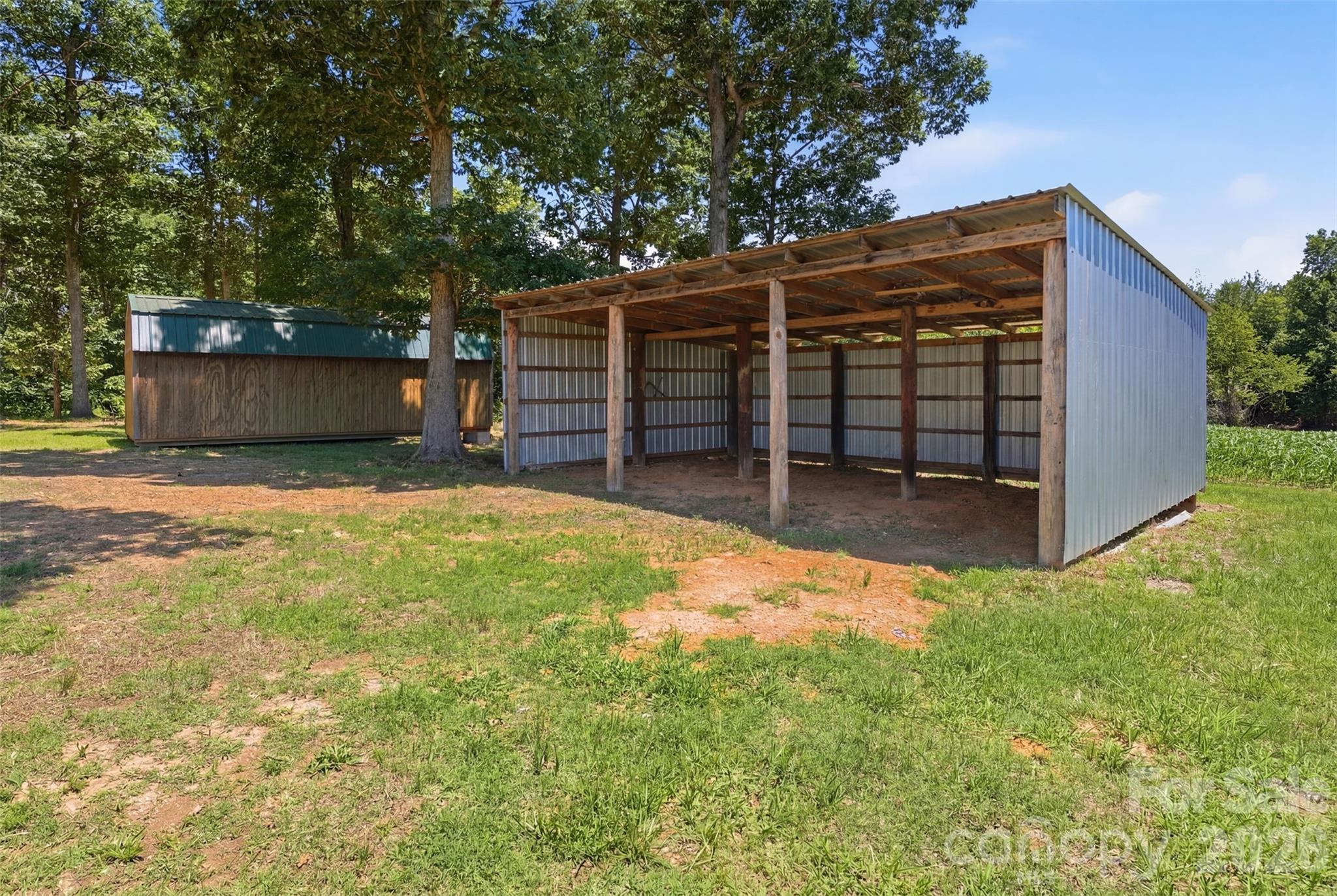 4406 Lucy Short Cut Road Marshville, NC 28103 - Photo 22 of 30 a view of a house with a yard and garage