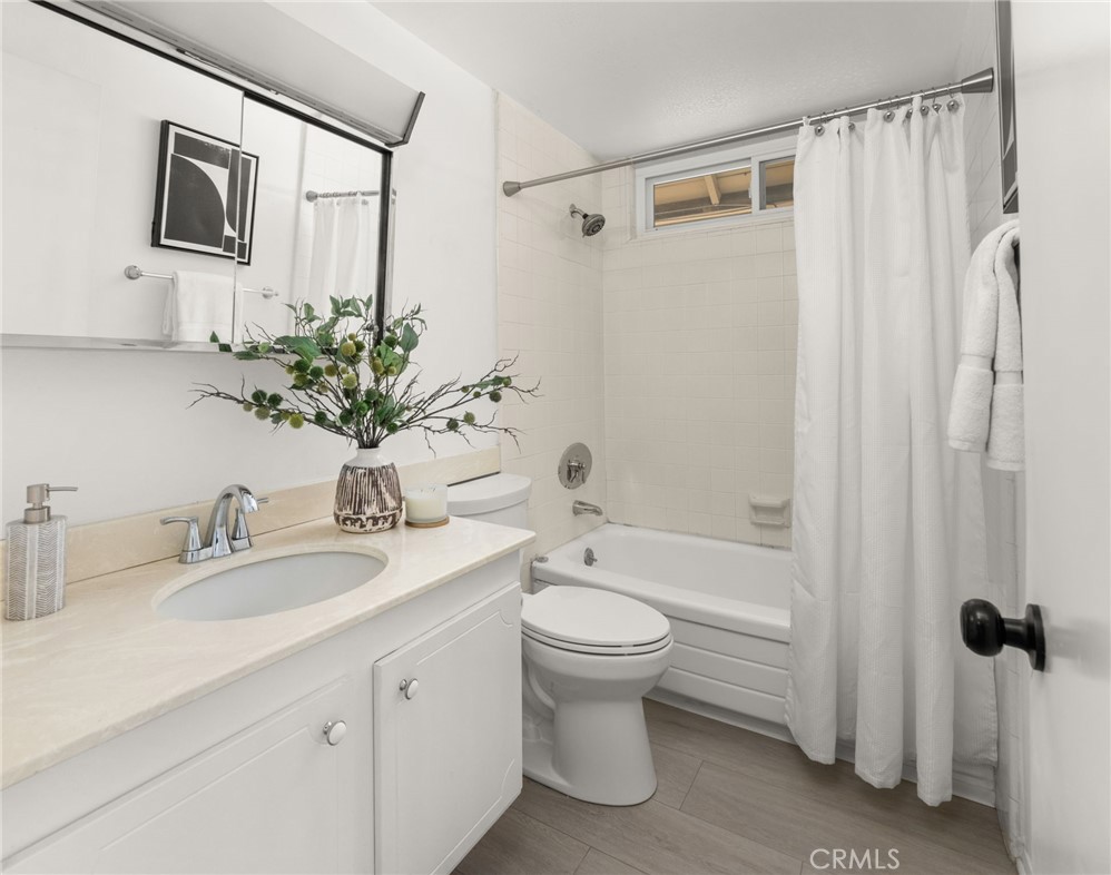 8242 Baldwin Circle Buena Park, CA 90621 - Photo 23 of 44 a bathroom with a sink toilet and shower
