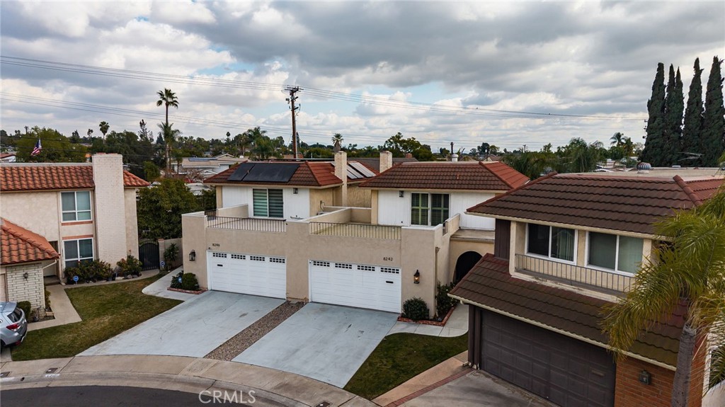 8242 Baldwin Circle Buena Park, CA 90621 - Photo 37 of 44 a aerial view of a house with a barbeque and wooden stairs