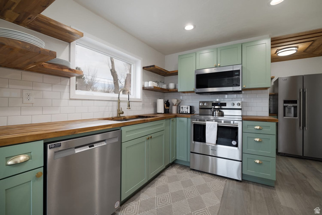 479 South 100 West Vernal, UT 84078 - Photo 5 of 13 Kitchen featuring green cabinets, wooden counters, open shelves, stainless steel appliances, and recessed lighting
