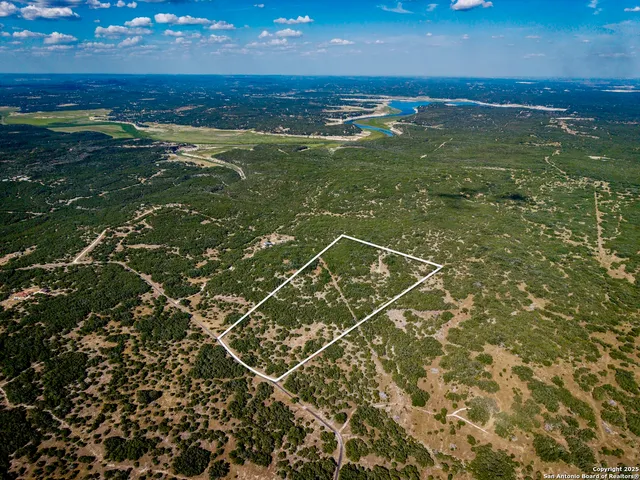 a view of a field with an ocean