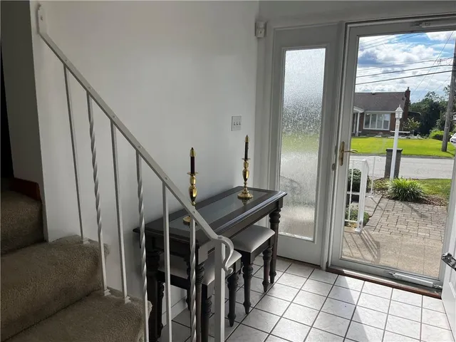 a view of an entryway with a front door