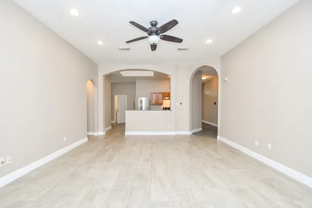 a view of empty room with a fireplace