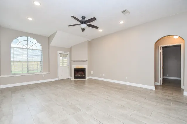 a view of an empty room with a window