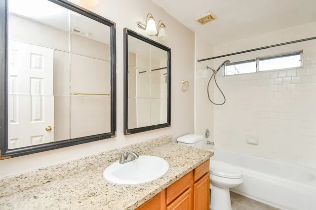 a view of a livingroom with wooden floor and potted plant