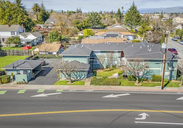 a view of multiple houses with a street