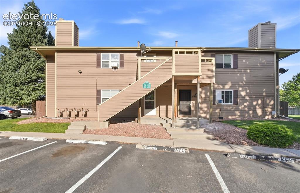 4357 Hunting Meadows Circle Colorado Springs, CO 80916 - Photo 1 of 20 front view of a house with a yard