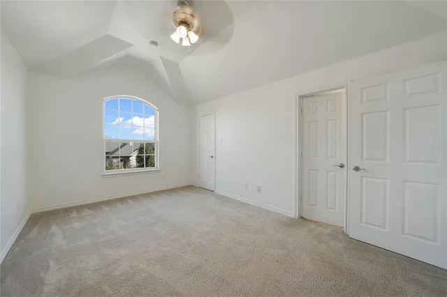 an empty room with a view of a bedroom