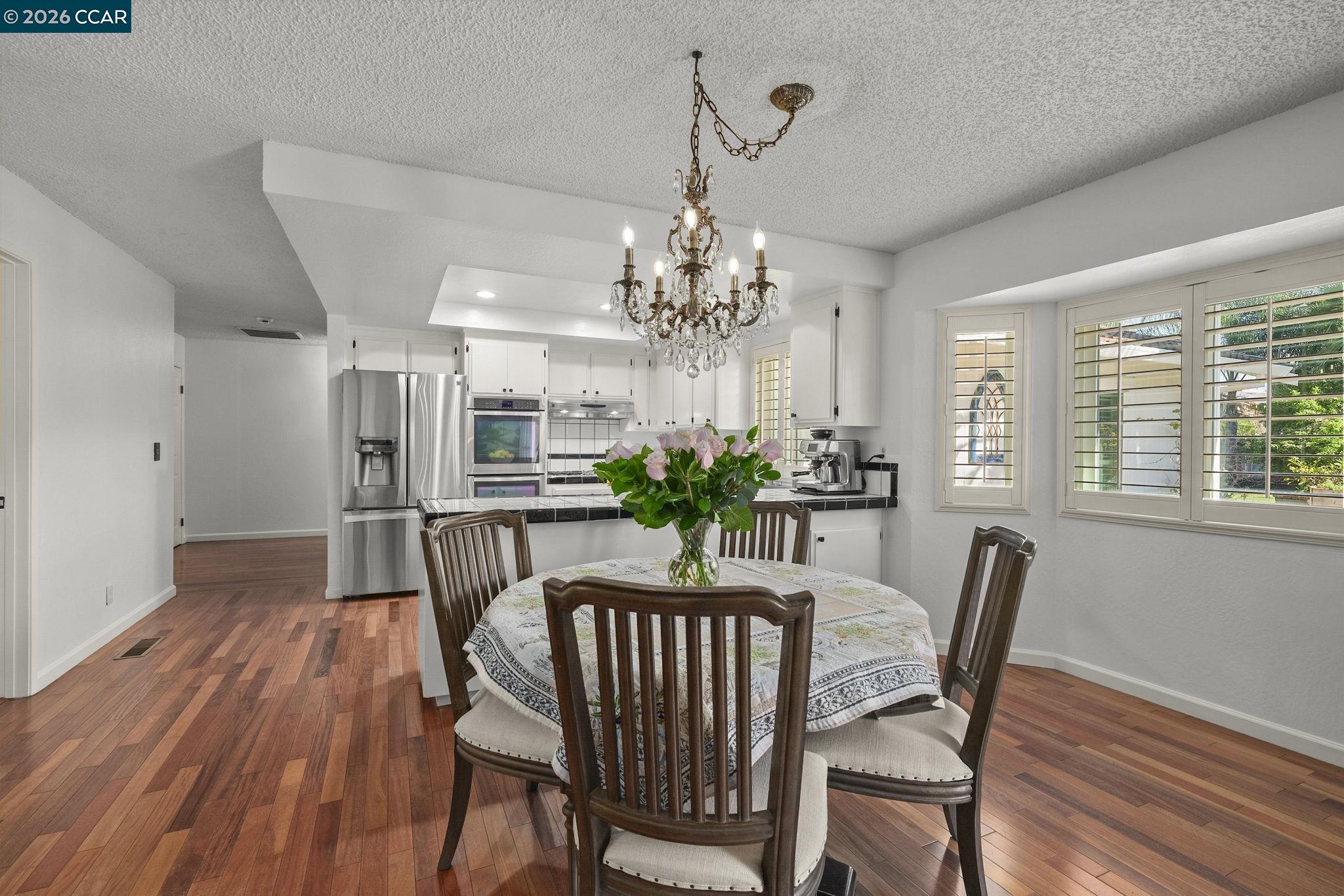 4151 Storey Lane Concord, CA 94518 - Photo 11 of 40 a view of a dining room with furniture window and wooden floor