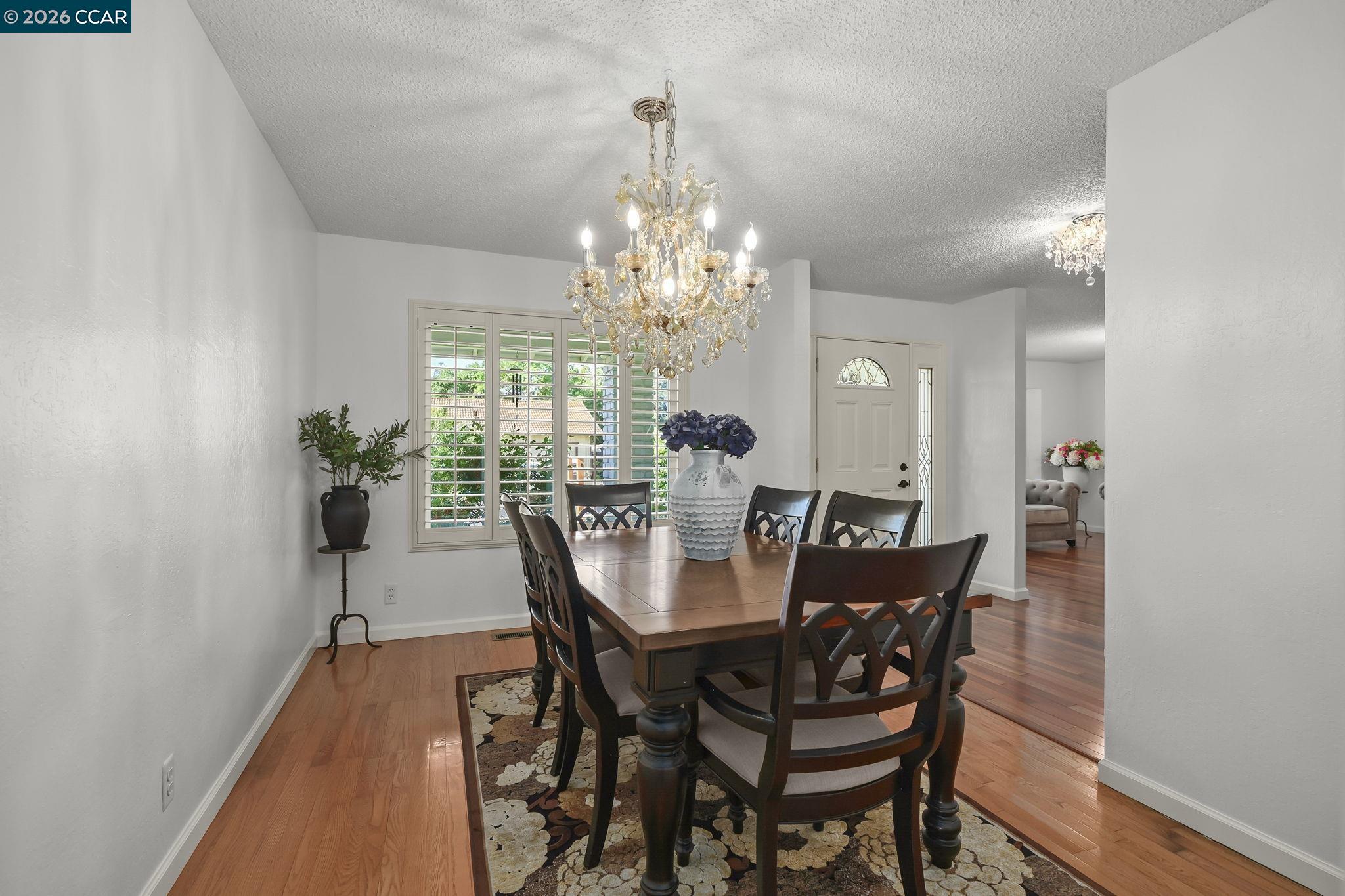 4151 Storey Lane Concord, CA 94518 - Photo 12 of 40 a view of a dining room with furniture and chandelier