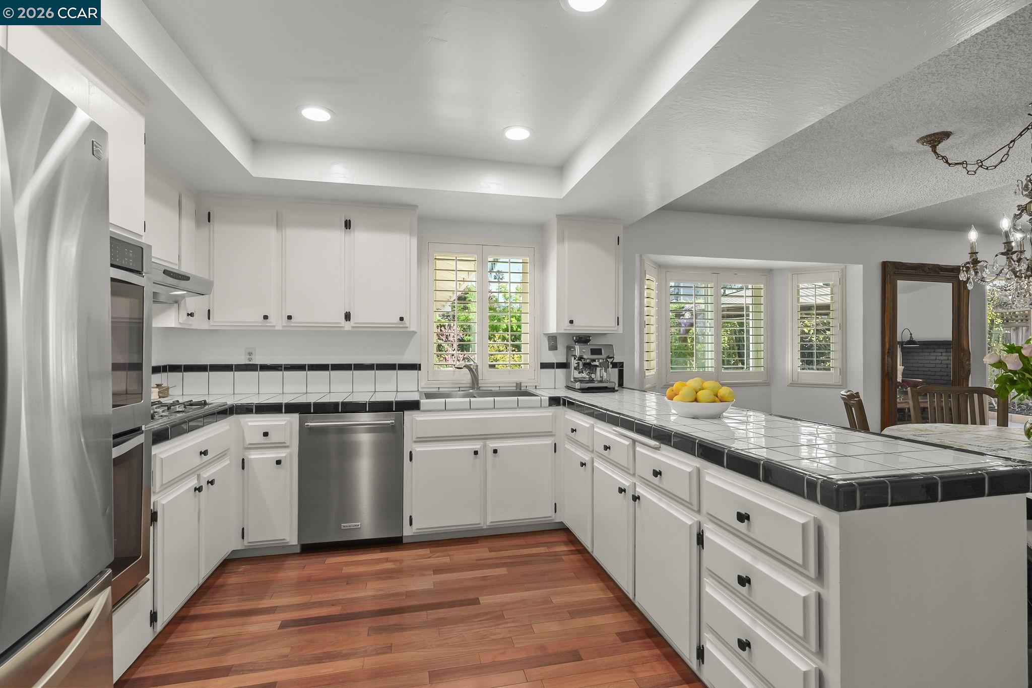 4151 Storey Lane Concord, CA 94518 - Photo 14 of 40 a kitchen with stainless steel appliances granite countertop a stove a sink and a refrigerator