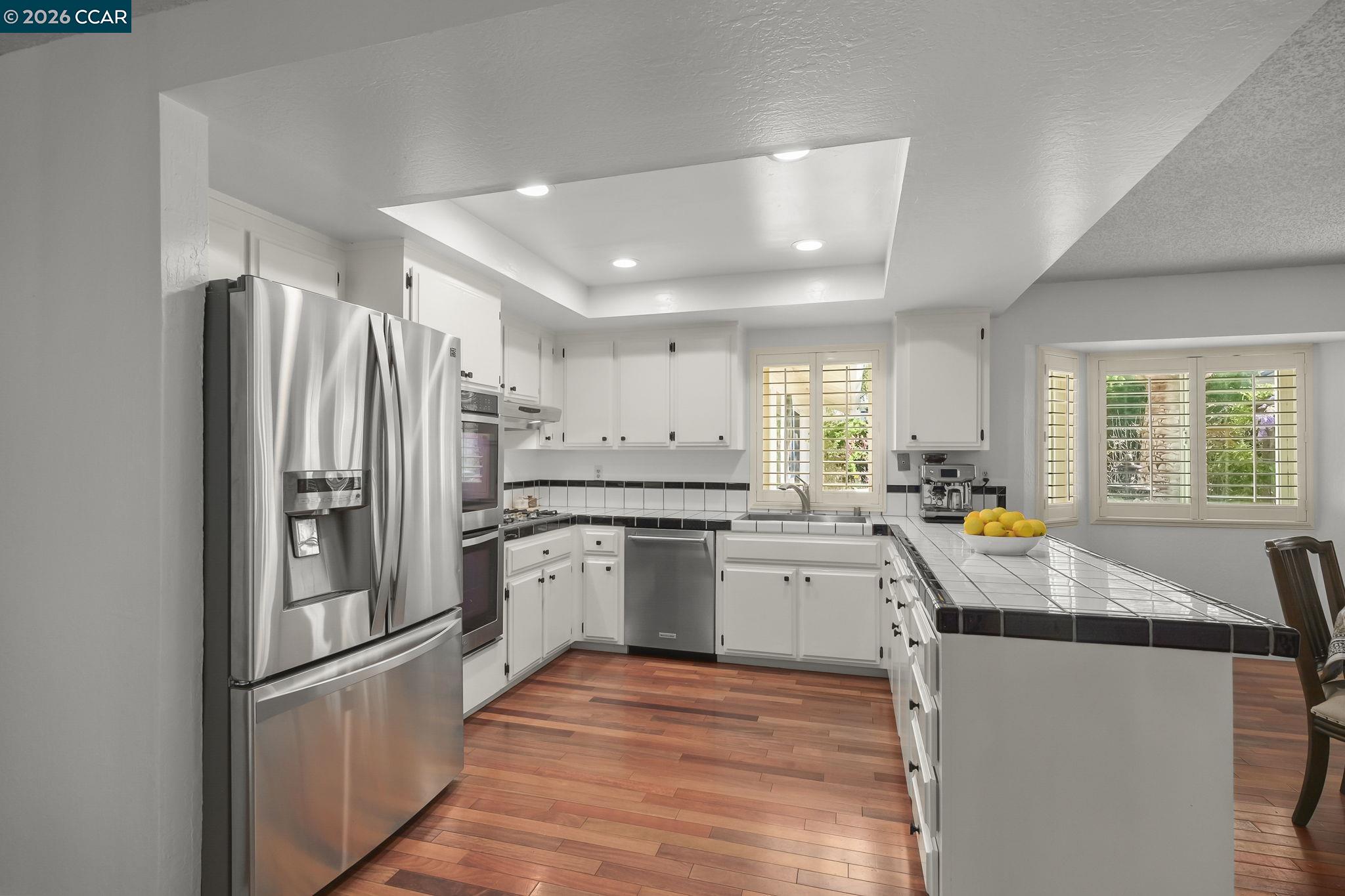 4151 Storey Lane Concord, CA 94518 - Photo 15 of 40 a kitchen with refrigerator and window