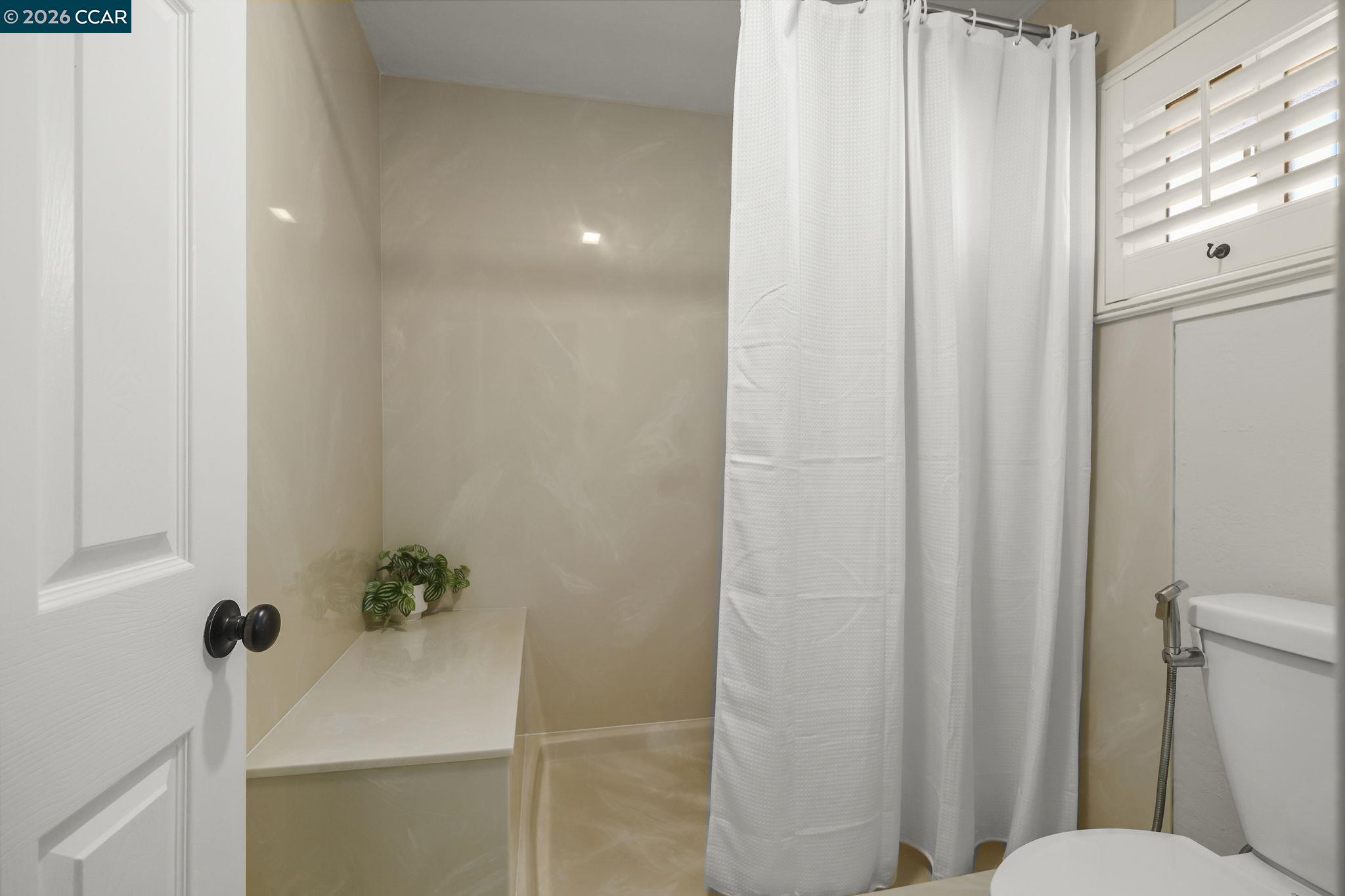 4151 Storey Lane Concord, CA 94518 - Photo 19 of 40 a bathroom with a sink and mirror with toilet