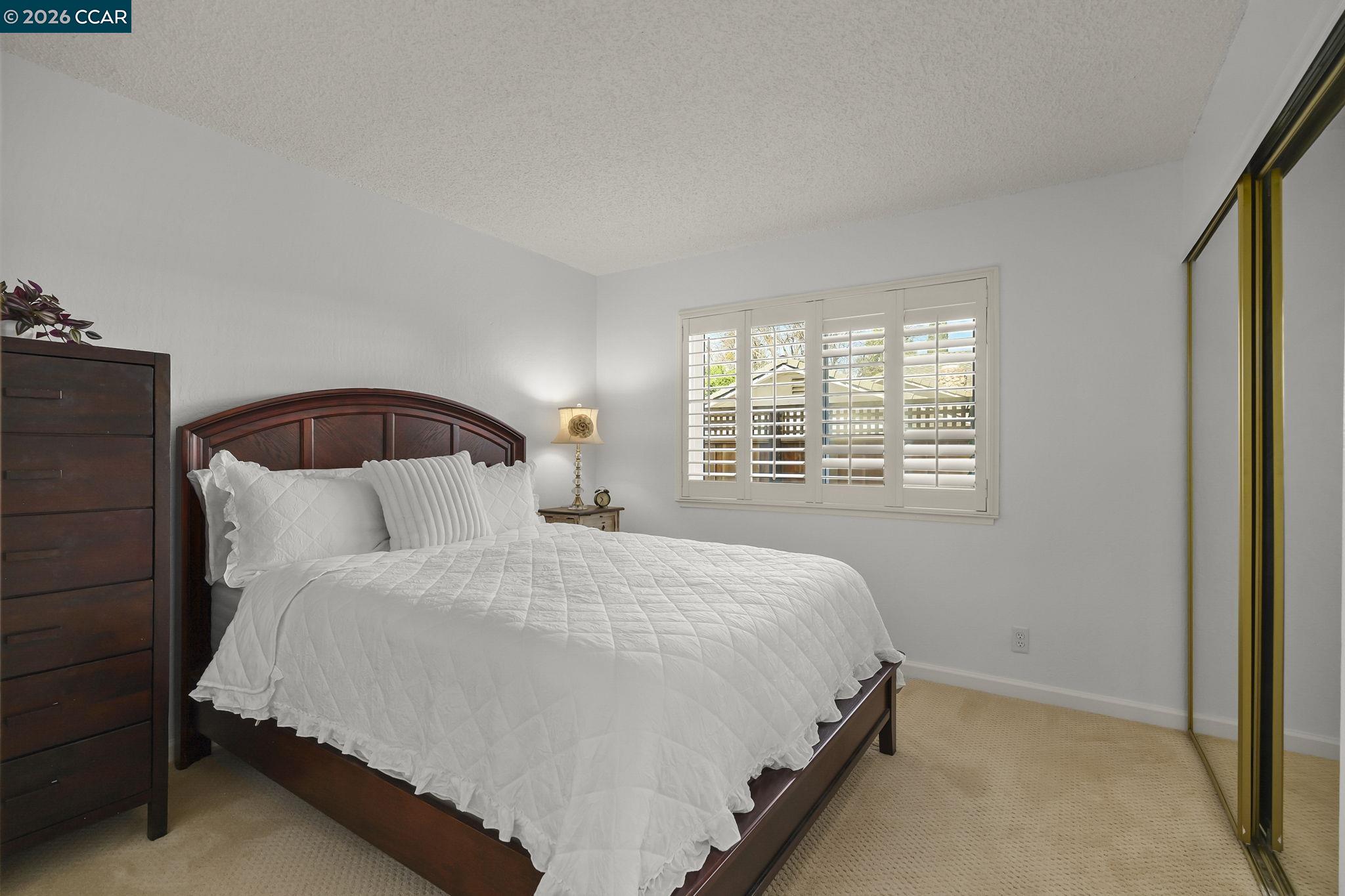 4151 Storey Lane Concord, CA 94518 - Photo 20 of 40 a bedroom with a bed and a window