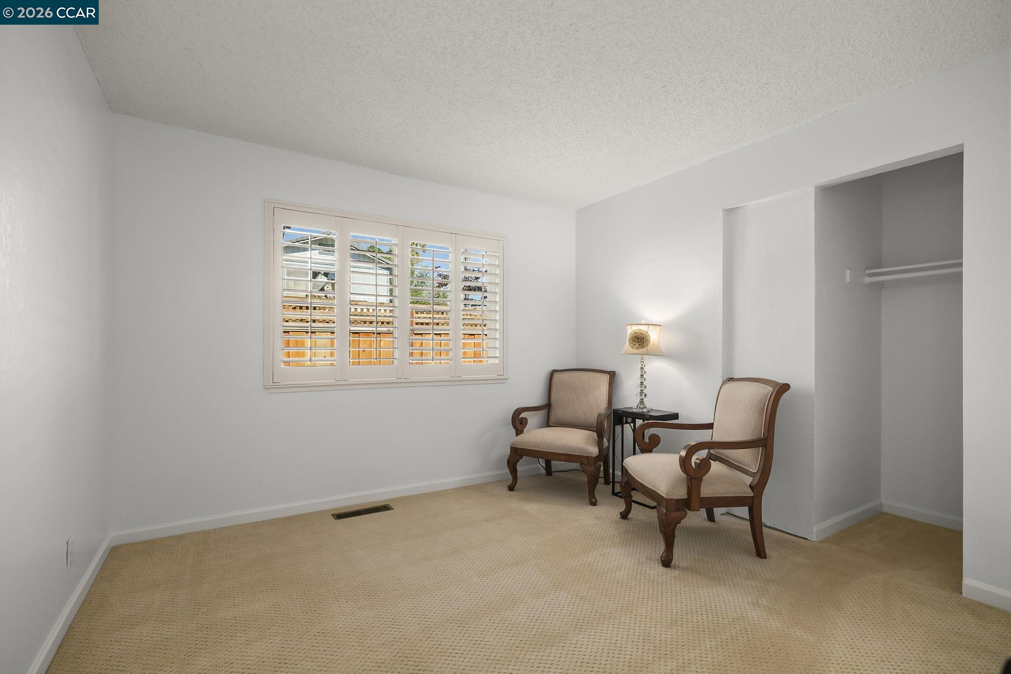 4151 Storey Lane Concord, CA 94518 - Photo 24 of 40 a livingroom with workspace and a window