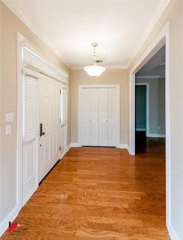 a view of a room with wooden floor and small space