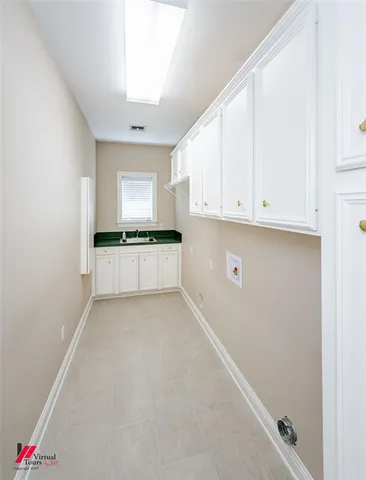 a view of a porch with a table and chairs