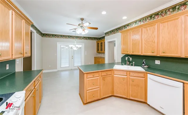 a kitchen with stainless steel appliances granite countertop a sink and cabinets