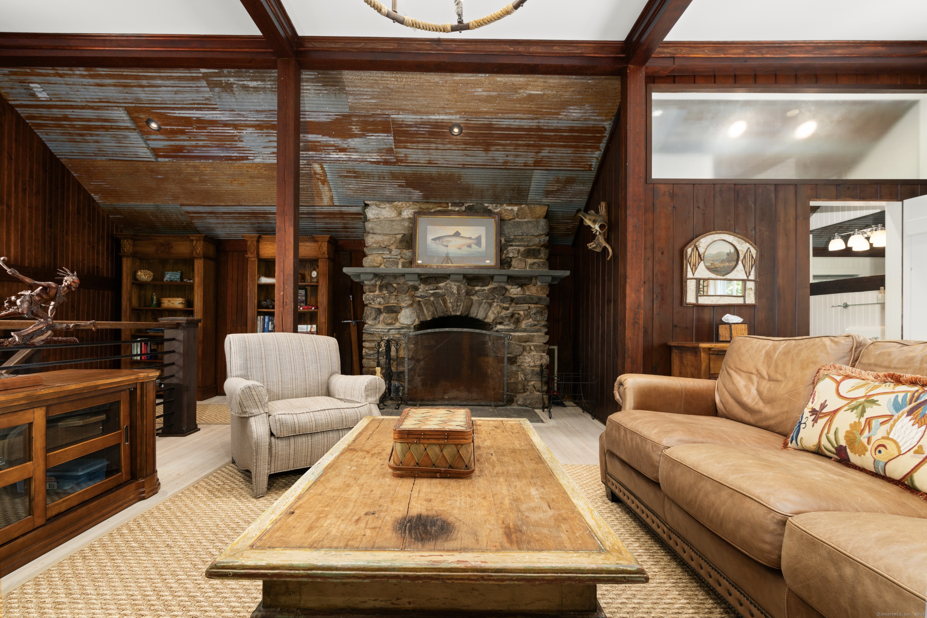 117 Elys Ferry Road Lyme, CT 06371 - Photo 26 of 40 a living room with furniture and a fireplace