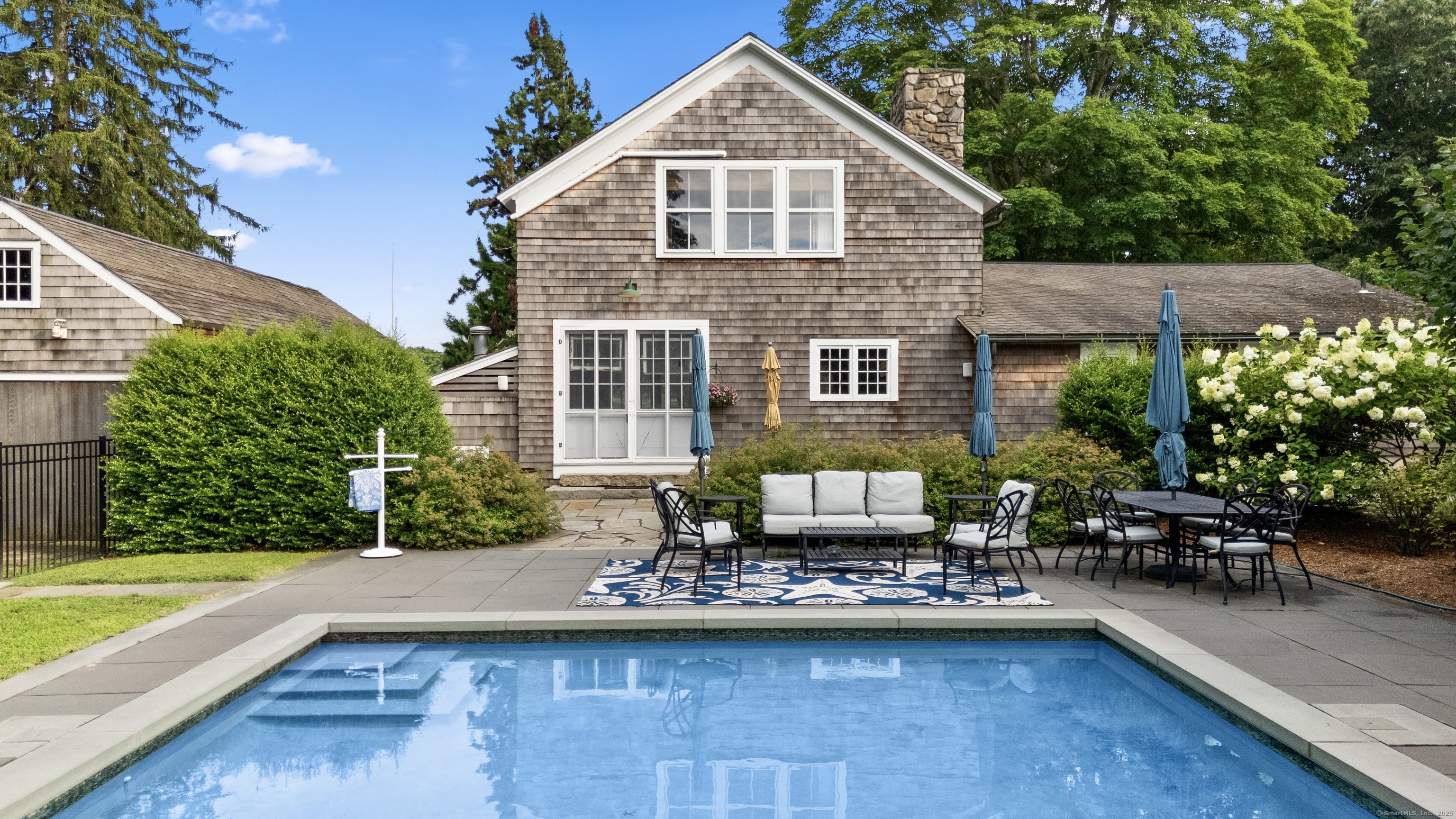 117 Elys Ferry Road Lyme, CT 06371 - Photo 33 of 40 a front view of a house with swimming pool having outdoor seating