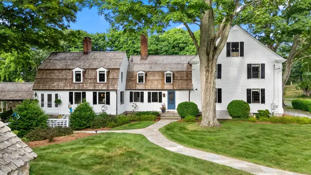 a front view of a house with garden