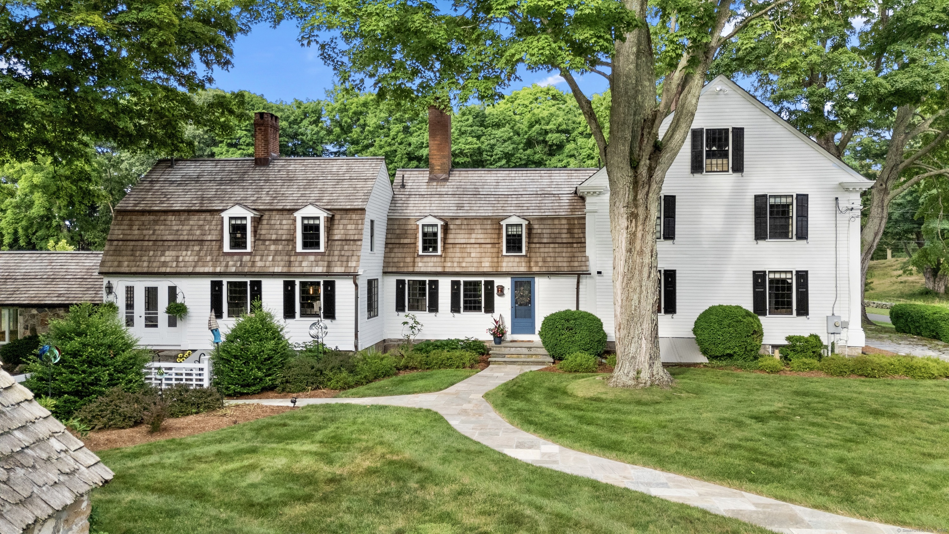 117 Elys Ferry Road Lyme, CT 06371 - Photo 34 of 40 a front view of a house with garden