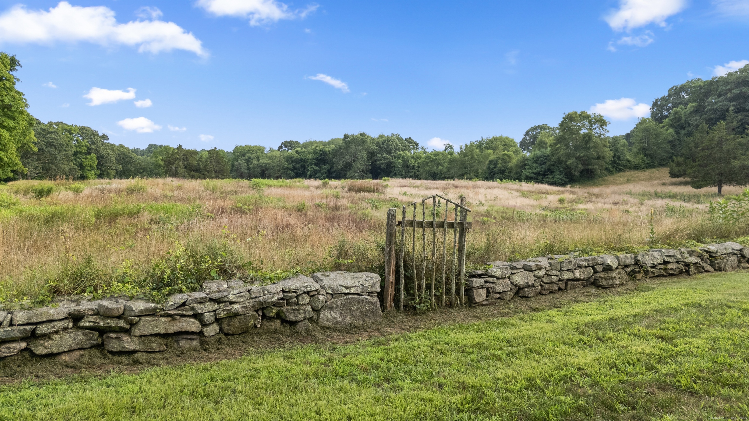 117 Elys Ferry Road Lyme, CT 06371 - Photo 40 of 40 a view of a lake with houses in the back