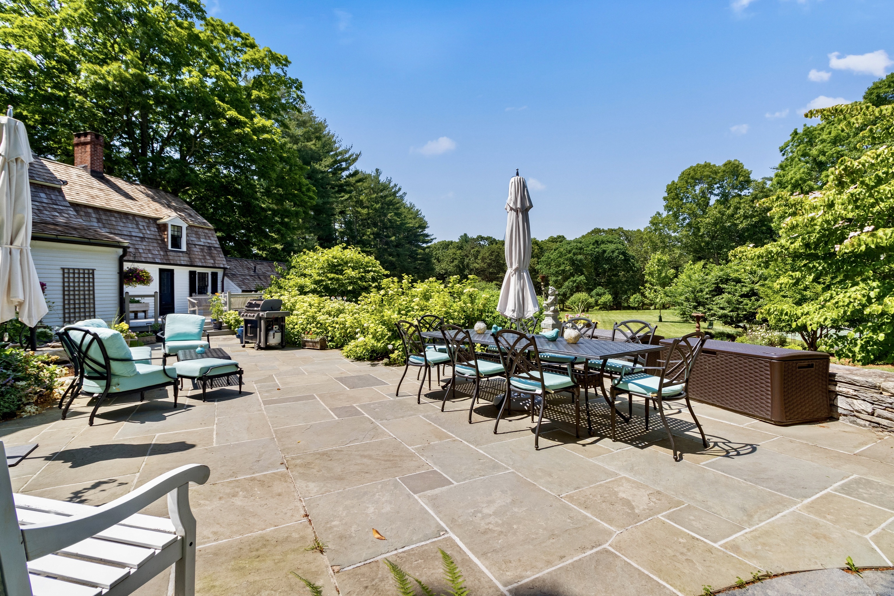 117 Elys Ferry Road Lyme, CT 06371 - Photo 4 of 40 a view of a patio with furniture and a garden